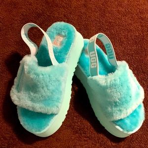 Women’s size 6, brand new, never worn, fuzzy teal colored UGG sandals.